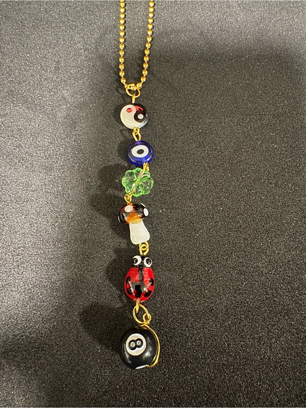 Gold-Tone Multi Charm keychain with Red Ladybug & Black 8-Ball
